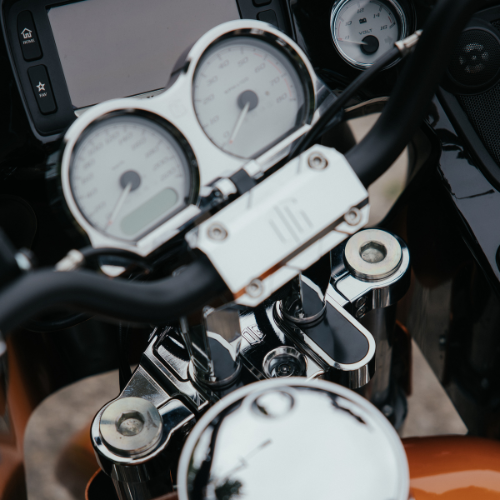 Chrome motorcycle handlebars with triple clamp and gauge cluster