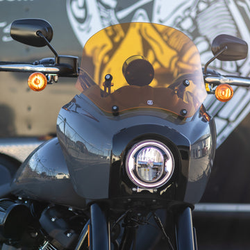 Amber-tinted motorcycle windscreen on black batwing fairing