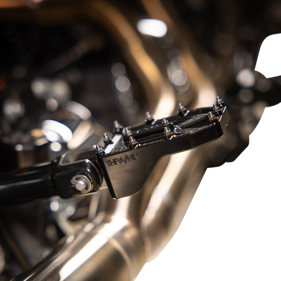 Thrashin Supply Co. Aggressor billet aluminum foot pegs with stainless steel cleats for Harley-Davidson Touring, Softail, Dyna, and Sportster