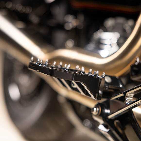Thrashin Supply Co. Mini Aggressor Floorboards with stainless steel cone cleats on billet 6061 aluminum for Harley-Davidson Softail Dyna Touring and Sportster models