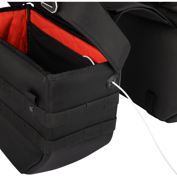 Thrashin Supply Co. Expedition Saddlebags in black ballistic nylon with MOLLE attachments and metal g-hook lids for Harley-Davidson Softail, Dyna, and FXR models