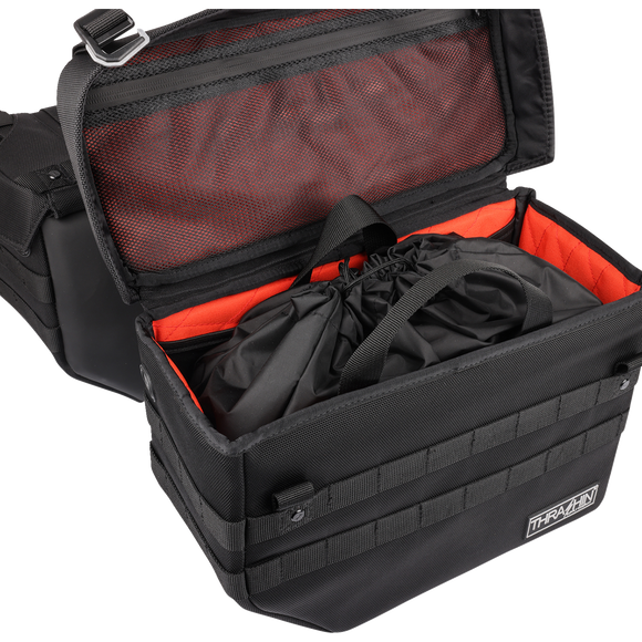 Thrashin Supply Co. Expedition Saddlebags in black ballistic nylon with MOLLE attachments and metal g-hook lids for Harley-Davidson Softail, Dyna, and FXR models