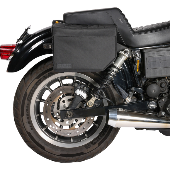 Thrashin Supply Co. Escape Base Saddlebags 18-liter in black ballistic nylon with MOLLE lid points and hi-viz orange interior