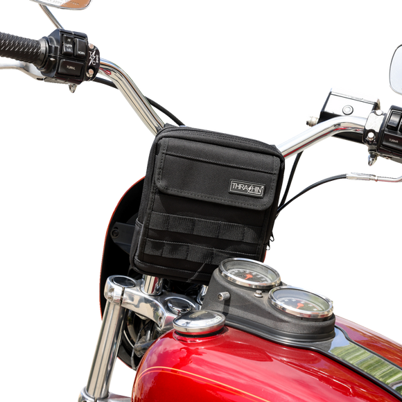 Thrashin Supply Co. Slim Handlebar Bag in black ballistic nylon mounted between fairing and gas tank on Harley-Davidson