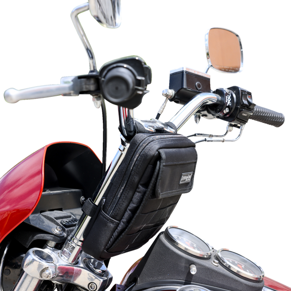 Thrashin Supply Co. Slim Handlebar Bag in black ballistic nylon mounted between fairing and gas tank on Harley-Davidson