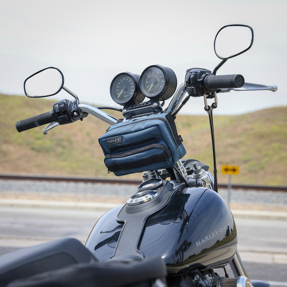 Thrashin Supply Co. ballistic nylon handlebar bag with YKK zippers and quick-attach straps mounted on Harley-Davidson handlebars