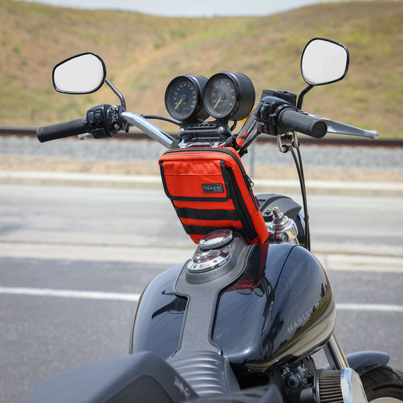 Thrashin Supply Co. Slim Handlebar Bag in black ballistic nylon mounted between fairing and gas tank on Harley-Davidson