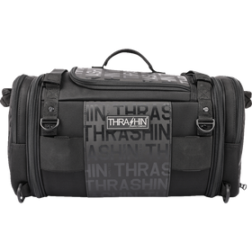 Thrashin Supply Co. Passenger Bag in black ballistic nylon with expandable dual-zipper design and hi-viz orange interior