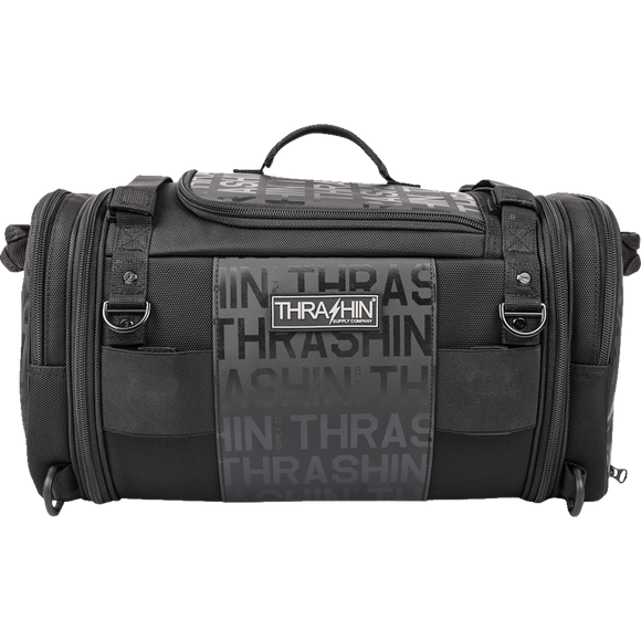Thrashin Supply Co. Passenger Bag in black ballistic nylon with expandable dual-zipper design and hi-viz orange interior