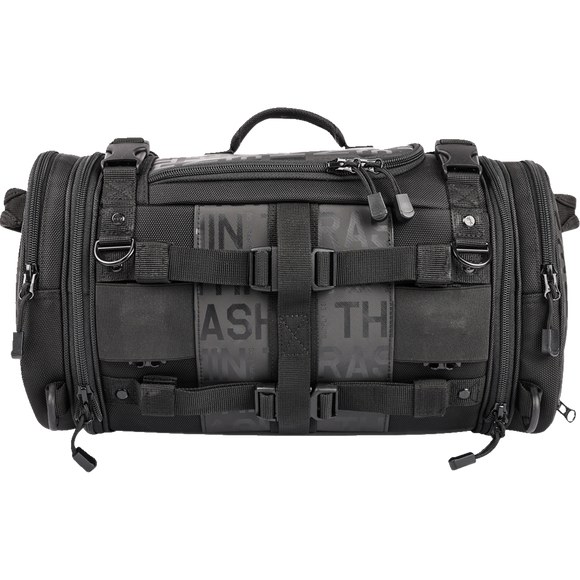 Thrashin Supply Co. Passenger Bag in black ballistic nylon with expandable dual-zipper design and hi-viz orange interior