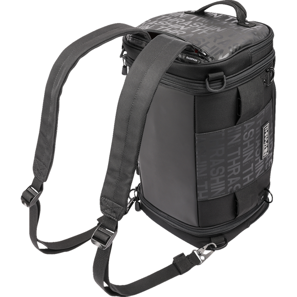 Thrashin Supply Co. Passenger Bag in black ballistic nylon with expandable dual-zipper design and hi-viz orange interior