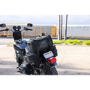 Thrashin Supply Co. Passenger Bag in black ballistic nylon with expandable dual-zipper design and hi-viz orange interior