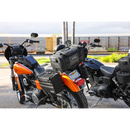 Thrashin Supply Co. Passenger Bag in black ballistic nylon with expandable dual-zipper design and hi-viz orange interior