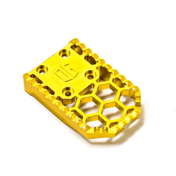 Gold CNC anodized aluminum motorcycle footpeg extension plate with honeycomb cutouts