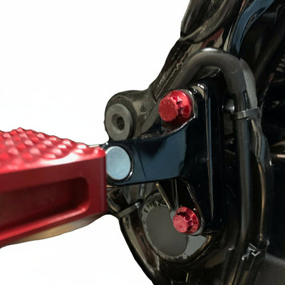 Close-up of Harley Road Glide passenger peg with red anodized ARP stainless steel bolts by Bamco