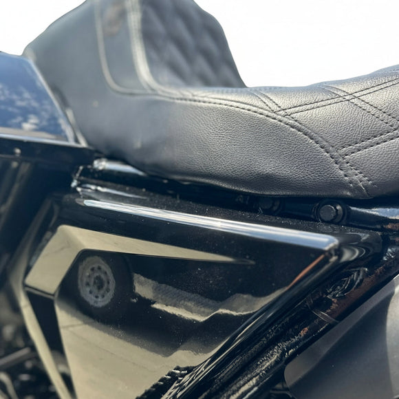 Close-up of Bamco ARP stainless steel bolt heads under Harley‑Davidson Road Glide seat on black side cover