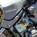 Close-up of Harley-Davidson Softail side showing Bamco ARP stainless steel gold-plated bolts beneath Saddlemen seat