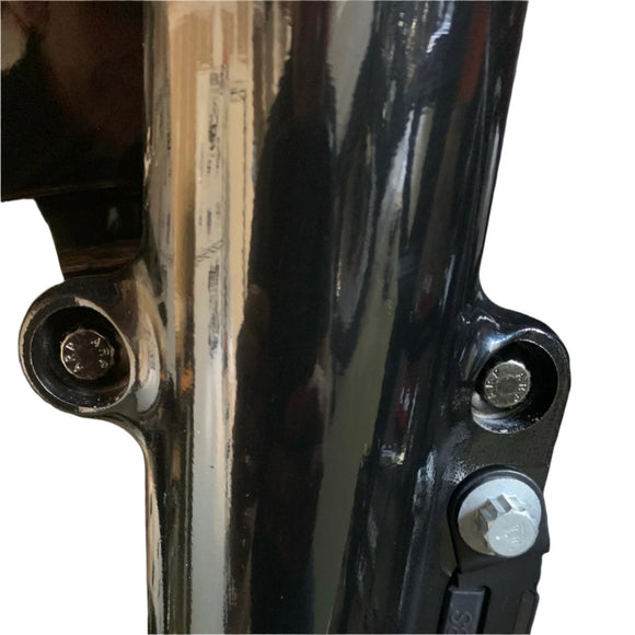 Close-up of Bamco ARP stainless steel 12-point bolts installed on Harley-Davidson bagger stock front fender mount