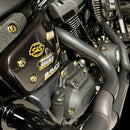 Close-up of Harley-Davidson Softail engine side cover showing gold Bamco ARP stainless-steel 12-point bolts
