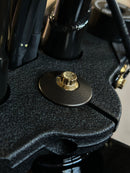 Close-up of gold ARP stainless steel bolt by Bamco on Harley-Davidson black textured top triple clamp