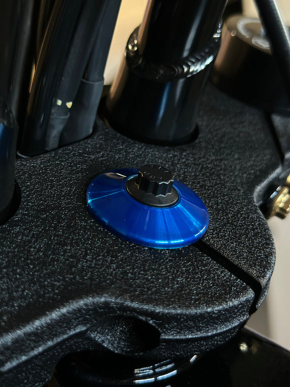 Close-up of ARP stainless steel bolt with blue anodized Bamco washer on Harley-Davidson top triple clamp