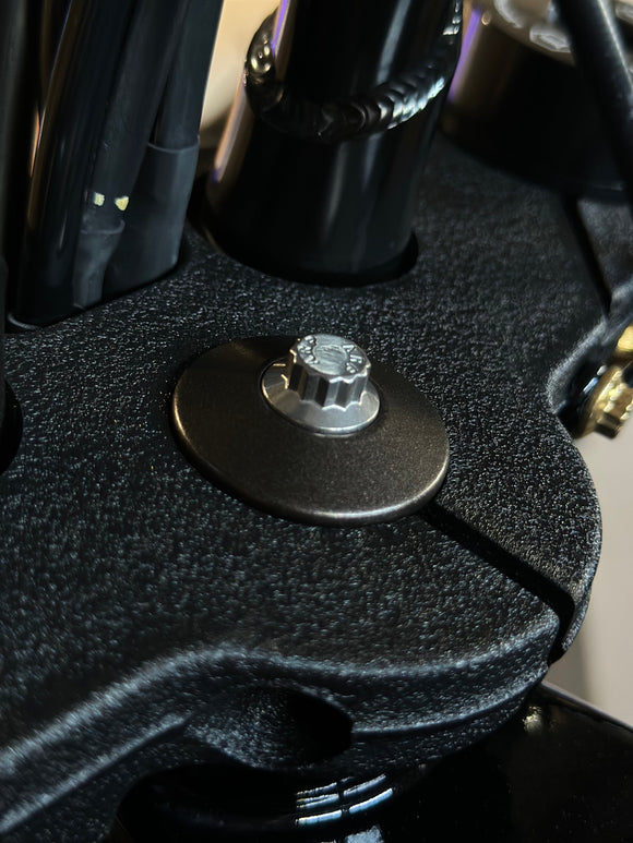 Close-up of ARP stainless steel Bamco bolt installed in Harley-Davidson top triple clamp