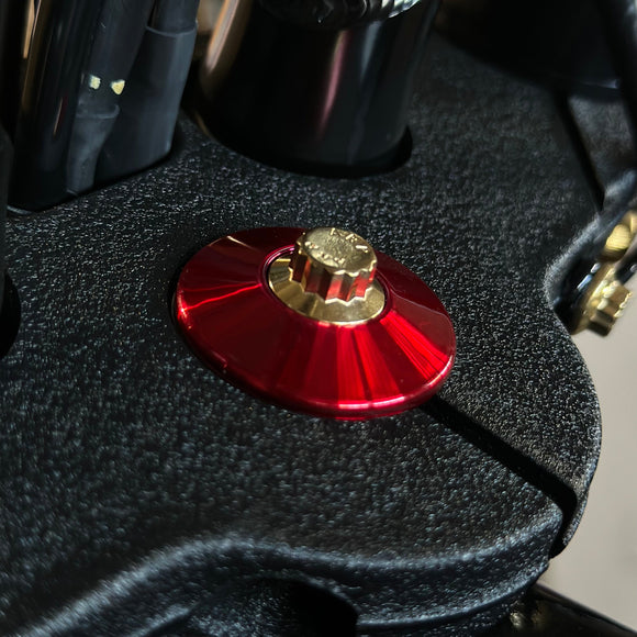 Bamco ARP stainless steel steering stem bolt with gold head and red anodized CNC washer on Harley Softail M8 top clamp