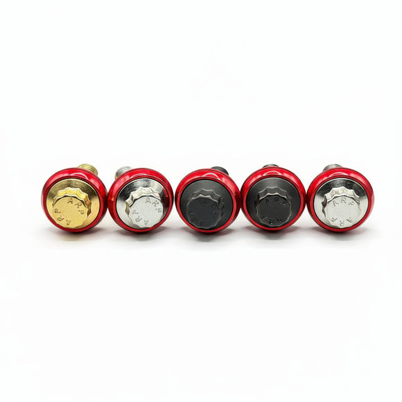 Five ARP stainless-steel Harley-Davidson bolts with red CNC powder-coated 7075 aluminum washers and assorted gold/silver/black caps — Bamco