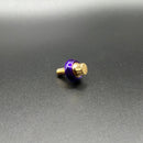 Bamco ARP stainless steel Harley-Davidson bolt with purple washer and gold head on black background