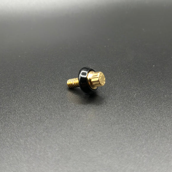 Bamco ARP stainless steel bolt for Harley‑Davidson, gold‑finish head with black flanged washer on dark background