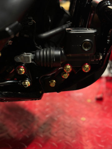 Close-up of BAMCO ARP stainless bolts installed on a Harley-Davidson M8 Softail, M8 Softail Brake Linkage ARP Kit