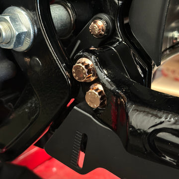 Close-up of BAMCO ARP stainless bolts installed on a Harley-Davidson M8 Softail, M8 Softail Swing Arm ARP Kit