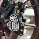 Close-up of BAMCO ARP stainless bolts installed on a Harley-Davidson M8 Softail, M8 Softail Caliper Pinch Bolt Kit