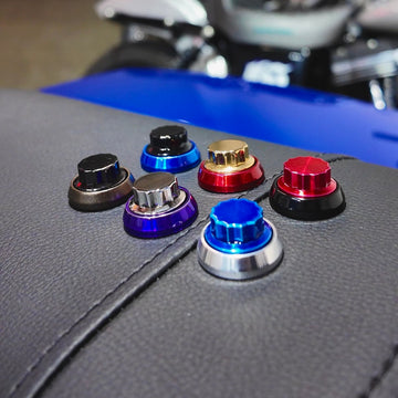 Close-up of the BAMCO 12 Point Billet Seat Bolt installed on a Harley-Davidson Harley