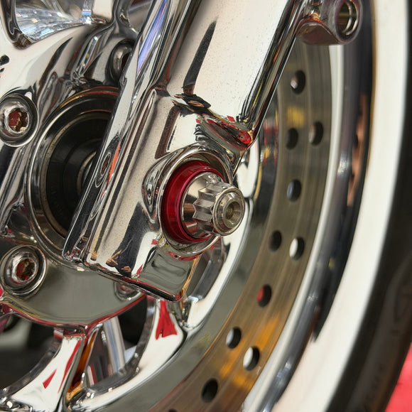 Close-up of BAMCO ARP stainless bolts installed on a Harley-Davidson 39mm, 39mm Front Axle ARP Nut Kit