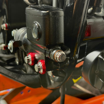 Close-up of BAMCO ARP stainless bolts installed on a Harley-Davidson M8 Softail, M8 Softail ARP Banjo Bolts