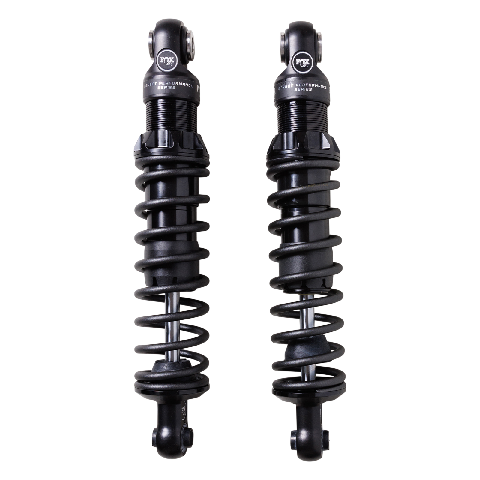 Pair of FOX IFP V‑Twin Street Performance rear shocks with matte black coil springs for Harley Sportster.