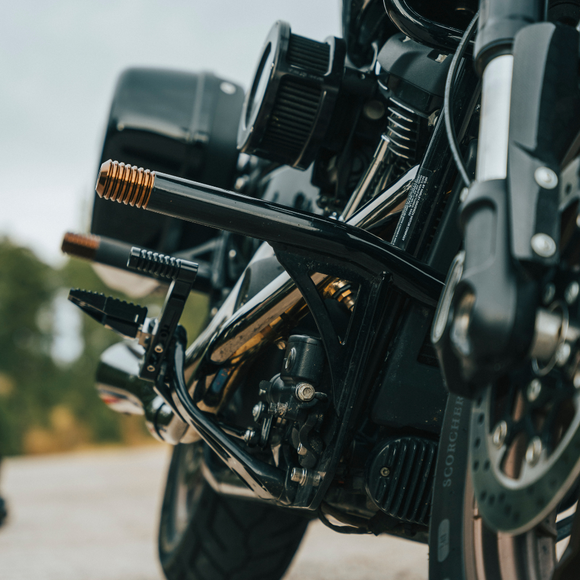 Black motorcycle crash bar engine guard with footpeg