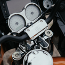 Chrome motorcycle handlebars with triple clamp and gauge cluster