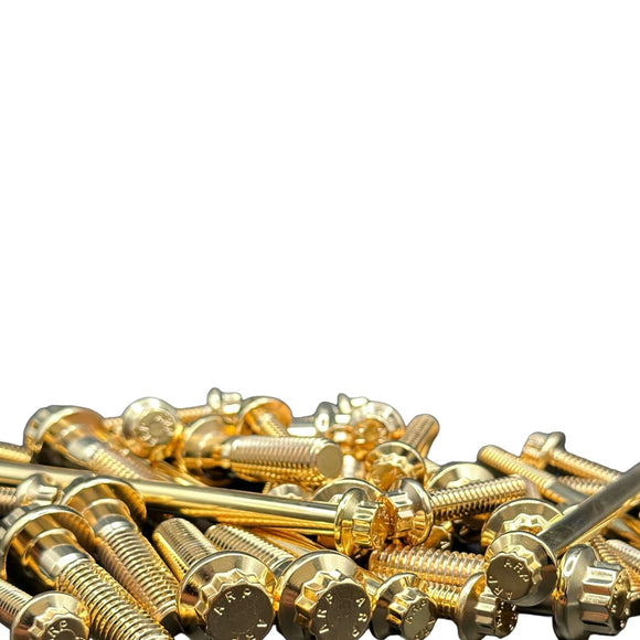 Close-up of gold ARP stainless steel bolts for Harley‑Davidson by Bamco