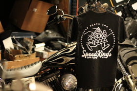 Black T-shirt with Speed-Kings Cycle Supply running pyramid design hanging on a Harley Davidson Dyna