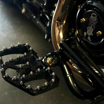 Close-up of BAMCO ARP stainless bolts installed on a Harley-Davidson Harley, ARP Footpeg Bolt Kit