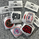 Collection of Speed Kings stickers in packaging on a gray surface