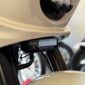 Close-up of a Low Rider ST Aux Light, Baja headlight and front fender.
