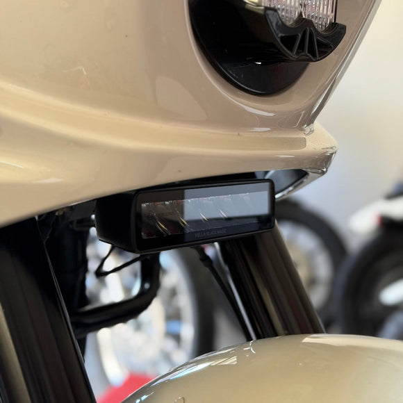 Close-up of a Low Rider ST Aux Light, Baja headlight and front fender.