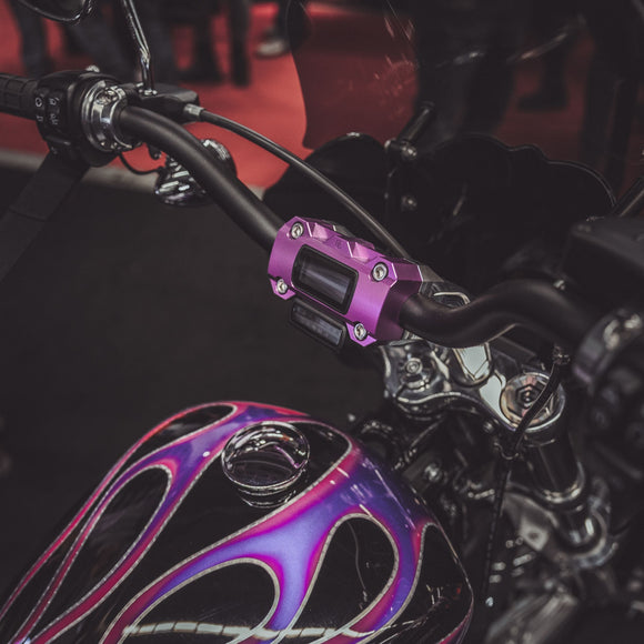 Purple M8 Softail handlebar riser clamp with numeric-analog gauge