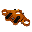 Orange anodized top triple tree clamp for touring motorcycles