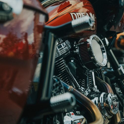 OG rear crash bar for Harley-Davidson Bagger, chrome saddlebag guard
Chrome V-twin motorcycle engine close-up with air cleaner and exhaust