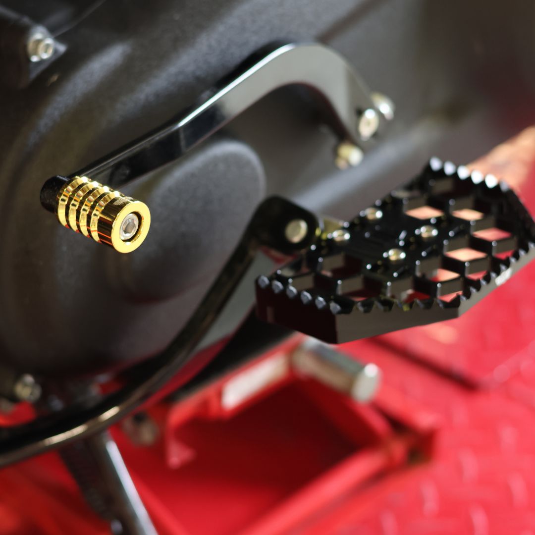 Gold OG Shorty motorcycle shifter peg on black shift lever