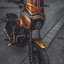 OG Speed 49mm fork brace on custom orange-gold motorcycle front end